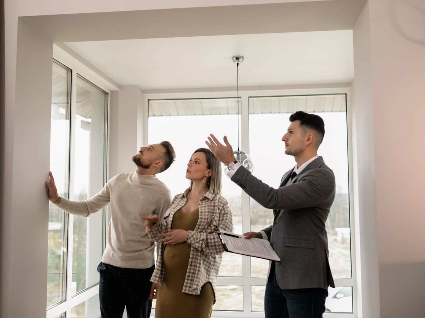 Couple viewing an apartment with a real estate agent