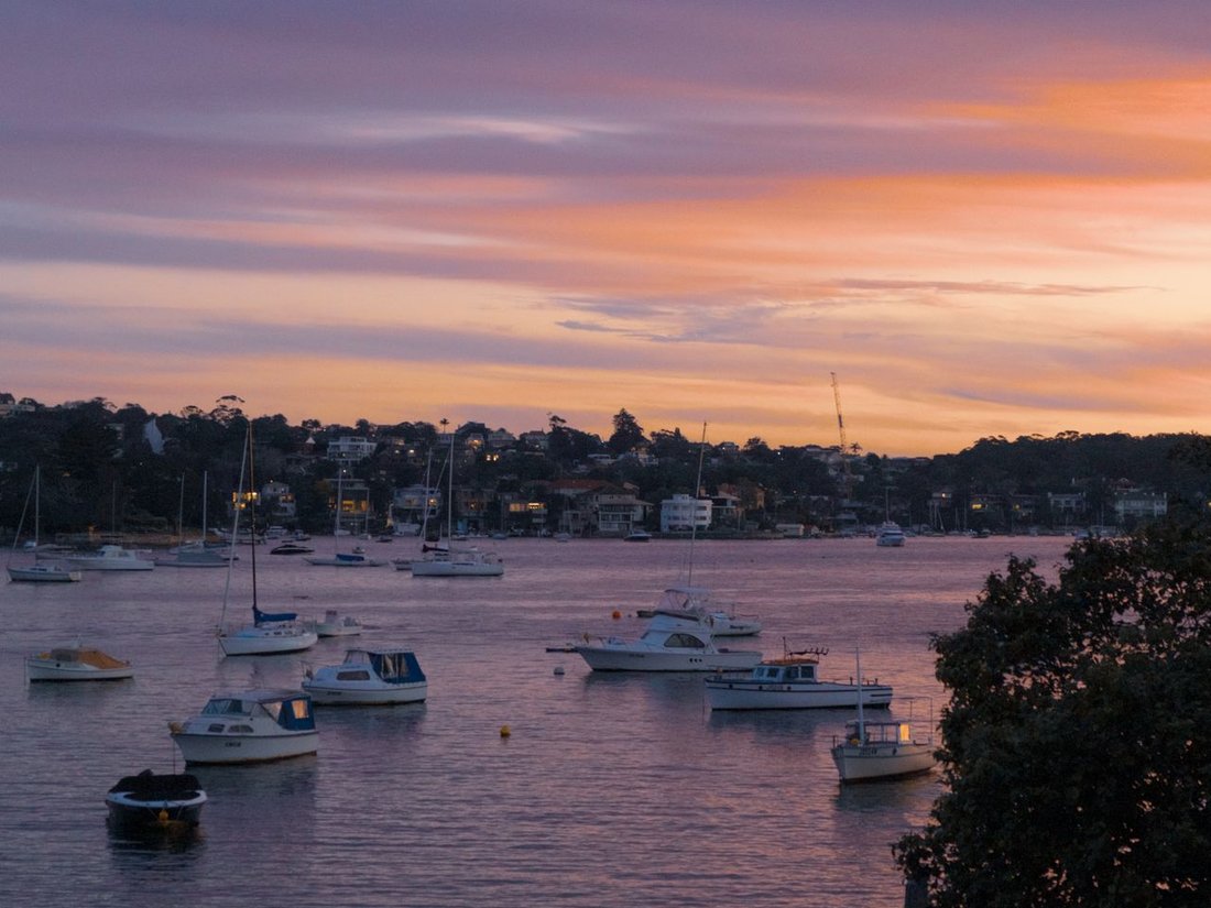 Boats moored at Rose Bay at sunset on Sydney Harbour