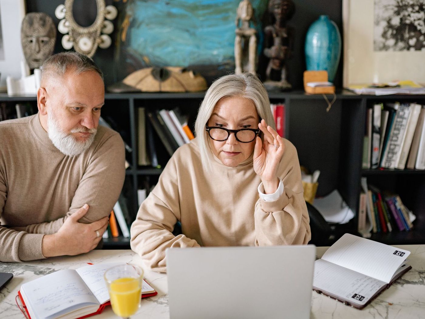 Couple reviewing their finances on a laptop at home