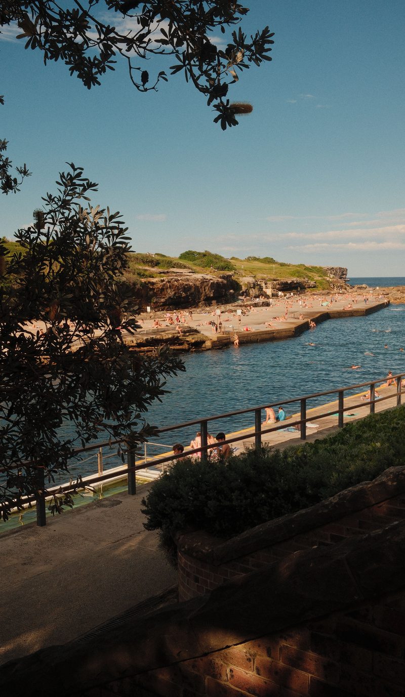 Clovelly Bay in the late afternoon, with the promenades along both sides of the inlet