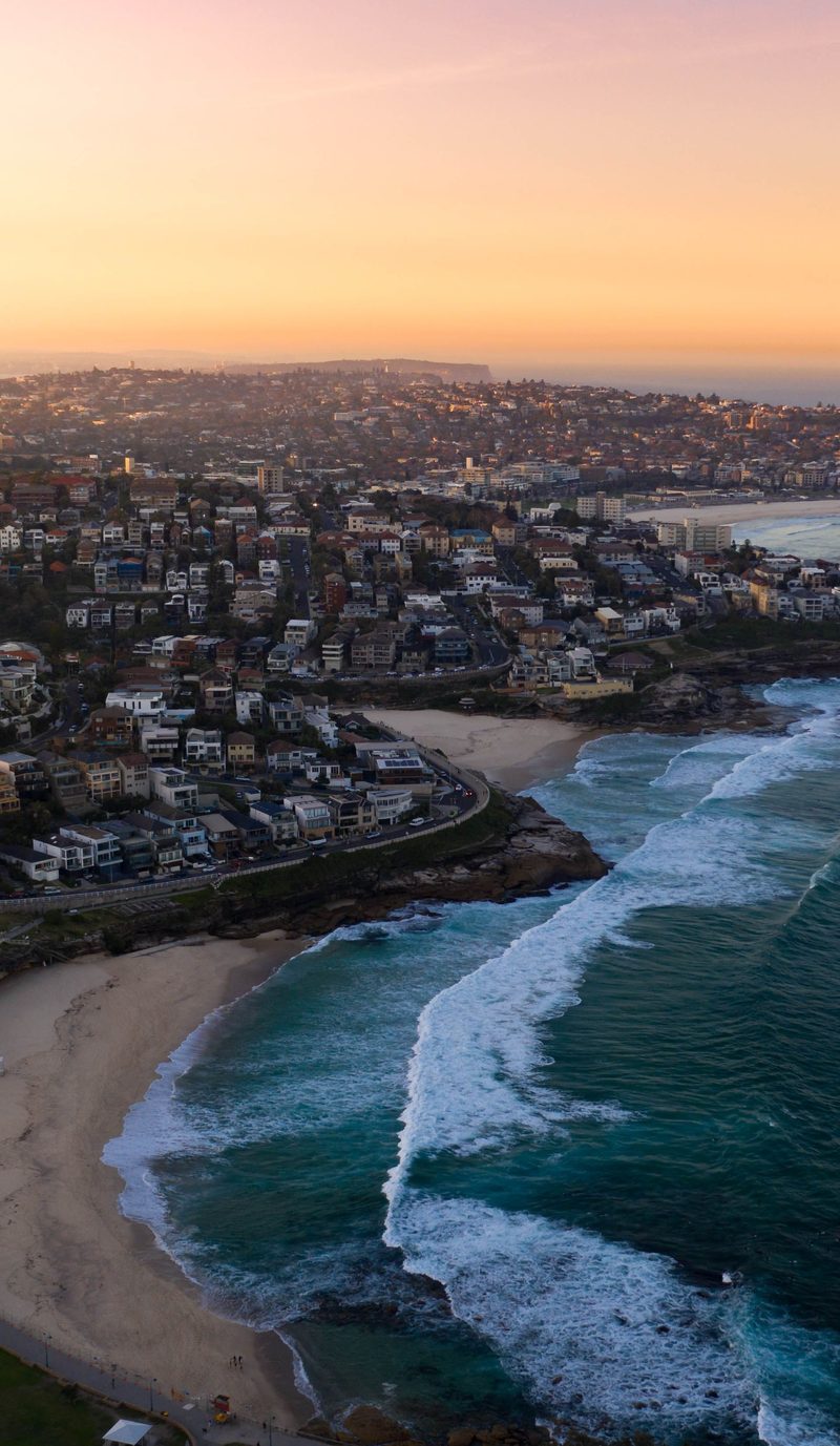 The beach and the coastline at dusk, seen from the air